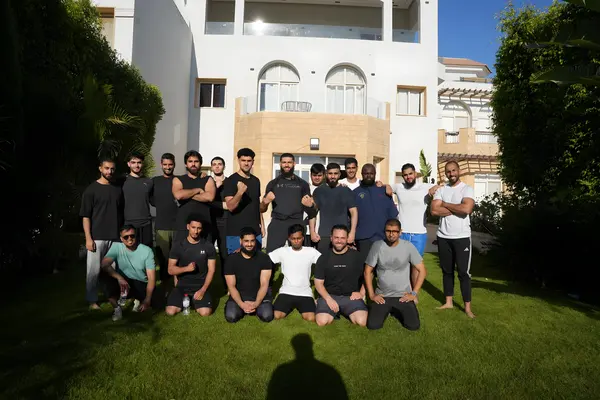 Group photo on a hotel lawn